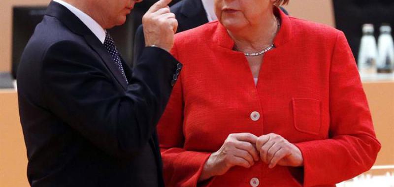 Vladimir Putin y Angela Merkel